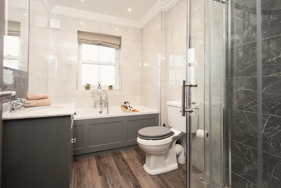 Bathroom with a bath and shower